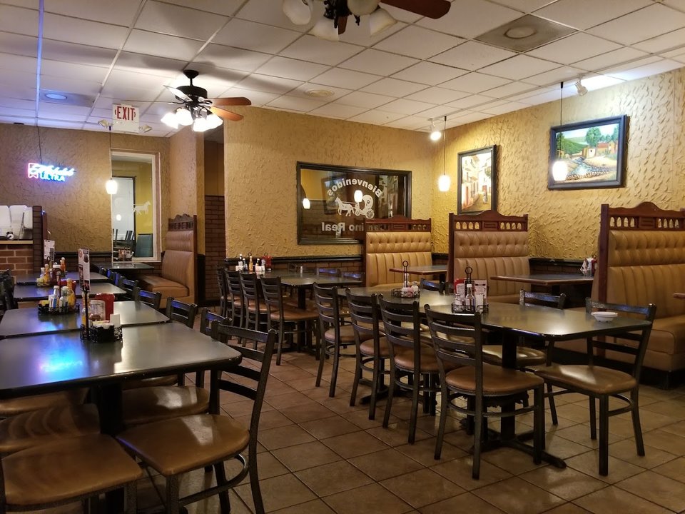Colorful Mexican restaurant dining room with table settings